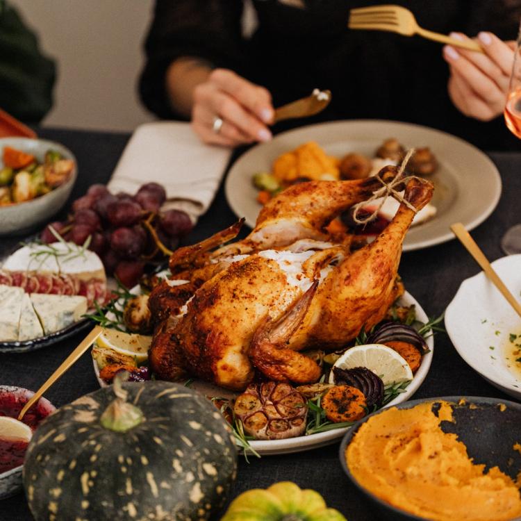 Roasted turkey surrounded by other food