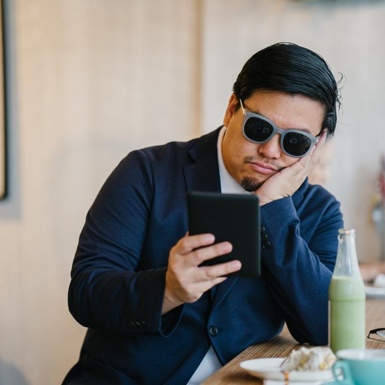 Man reading an e-reader